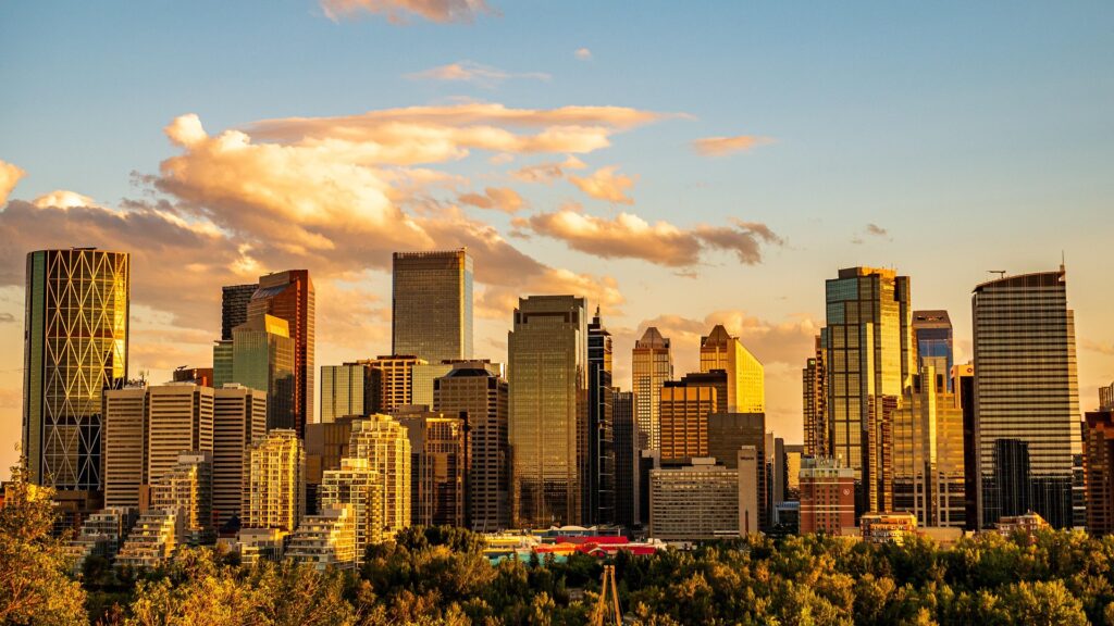 Calgary city skyline at sunset with modern buildings and colorful sky