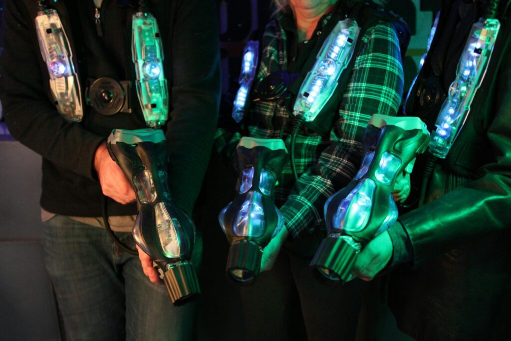 Players wearing laser tag gear during an exciting birthday party game in Calgary