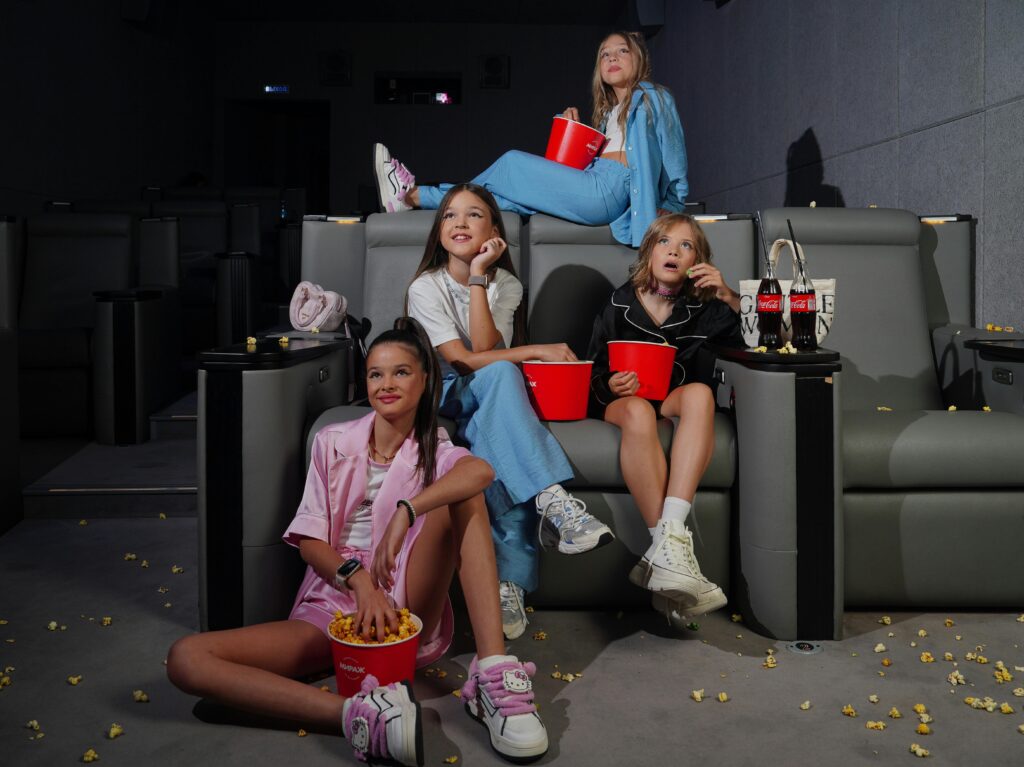 Birthday party ideas Calgary, young girls watching a movie at a cinema birthday party