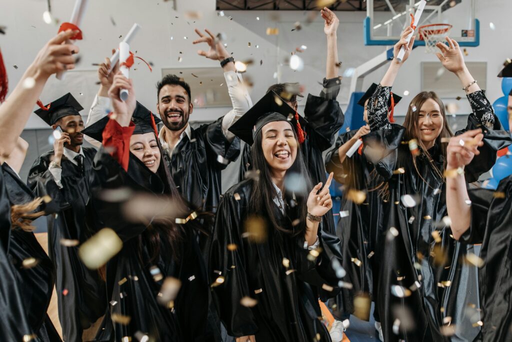 Graduation party venue Calgary with students in caps and gowns celebrating their achievement